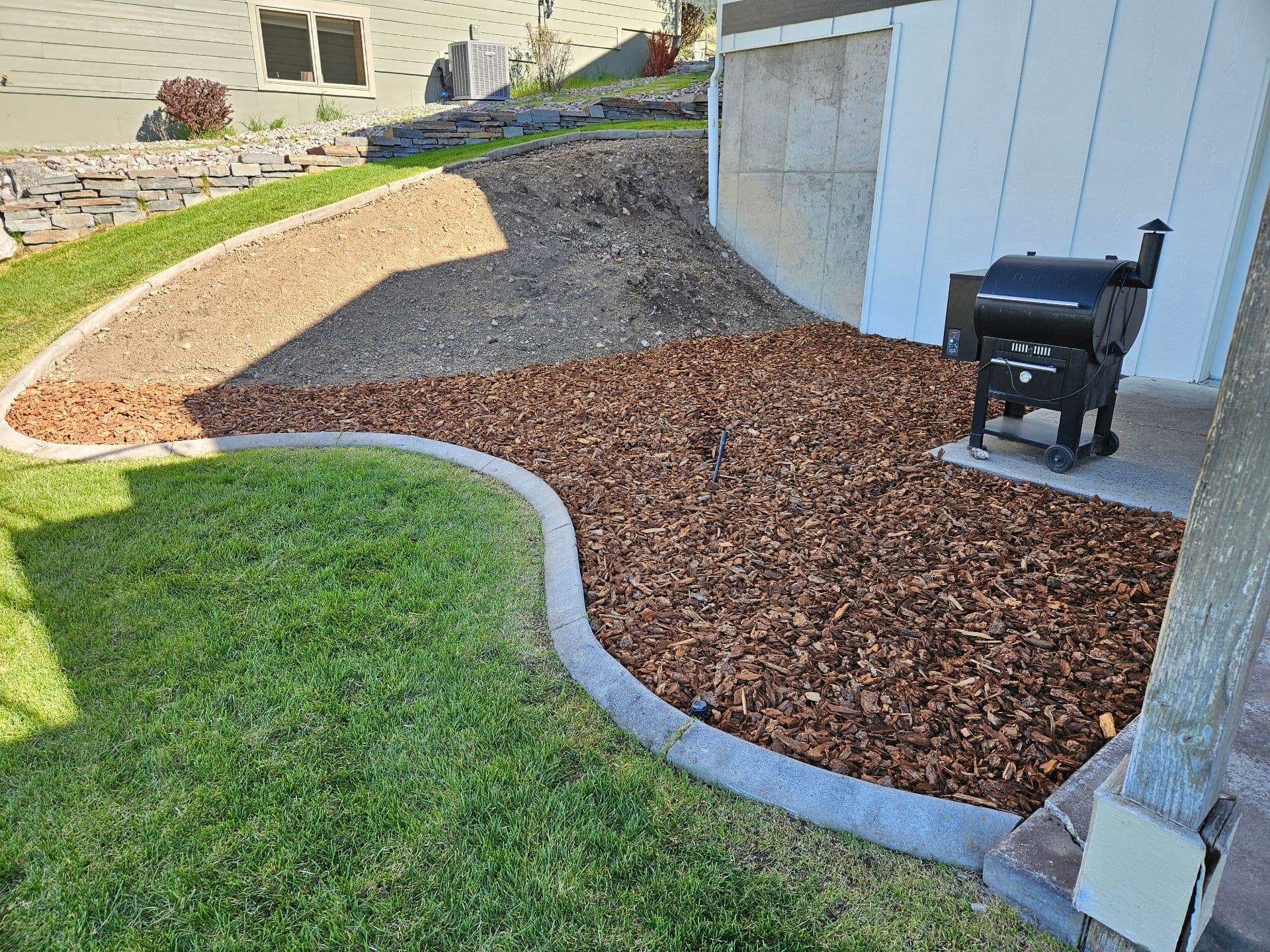Gallery photos for Backyard Makeover with Mulch Installation in Missoula: Image #1