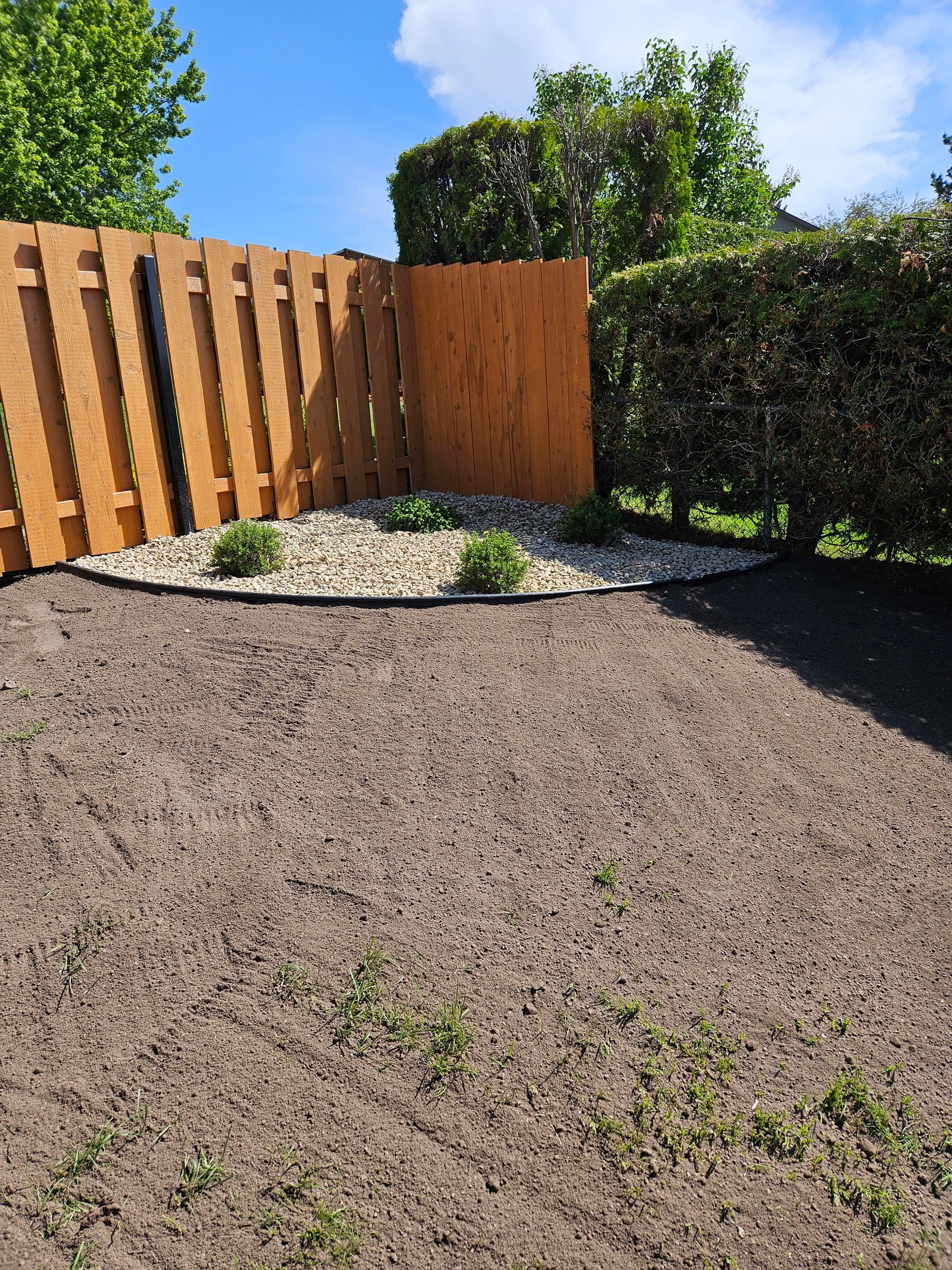 Storm Damage Cleanup With Regrading and a Rock Bed Finish image